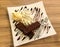 Brownie with Vanilla Ice Cream with Chocolate Sauce Served on White Dish