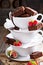 Brownies in stacked coffee cups with chocolate sauce