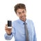 Browsing on your mobile. Studio shot of a young businessman holding a blank cellphone screen up to the camera isolated