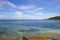 Brucoli scenic view of blue transparent sea, blue Spring sky and Etna in background