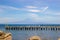 Brucoli seascape looking at Etna from the port, wooden pier in the blue sea, clear colours