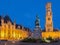 Bruge - Grote markt in evening dusk. Belfort van Brugge and Provinciaal Hof buildings