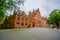 BRUGES, BELGIUM - 11 AUGUST, 2015: Beautiful large red brick building