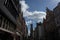 BRUGES, BELGIUM - 16 April 2017: A bird flies above the belfry tower on a bright sunny day in Bruges, Belgium