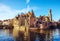 Bruges, Belgium. Image with Rozenhoedkaai in Brugge, Dijver river canal and Belfort (Belfry) tower