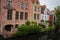 Bruges, Belgium - May 12, 2018: Unique Houses Above A Water Channel