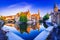 Bruges, Belgium. Sunrise on Rozenhoedkaai, old town with Belfry reflection
