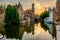 Bruges Brugge cityscape with water canal at sunset