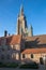 Bruges - Church of Our Lady from yard of Saint John Hospital (Sint Janshospitaal) in evening