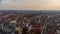 Bruges city skyline with red tiled roofs, Rozenhoedkaai Quay of the Rosary canal and Saint Magdalene Church tower in winter day