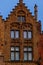 Bruges, Flanders, Belgium, Europe - October 1, 2019. Details of facades medieval old brick houses on the ancient streets in