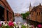 Bruges, Flanders, Belgium, Europe - October 1, 2019. Medieval ancient houses made of old bricks and water canals on ancient