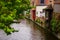 Bruges, Flanders, Belgium, Europe - October 1, 2019. Medieval ancient houses made of old bricks and water canals in Bruges Brugge