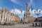 Bruges - Grote markt with the Belfort van Brugge and Provinciaal Hof buildings and memorial of Jan Breydel and Pieter De Coninck