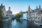 Brugge, Belgium - 5 Nov, 2018: Tourist boat passes past Rozenhoedkaai