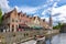 Brugge canals and architecture with church of Our Lady at background, Belgium