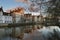 Brugge evening cityscape. Old buildings at water channel in Bruges