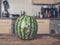 Bruised watermelon in kitchen