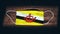 Brunei National Flag at medical, surgical, protection mask on black wooden background. Coronavirus Covidâ€“19, Prevent infection,