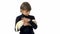Brunet boy is holding and stroking albinos ferret furo with red eyes at white background. Slow motion.