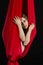 Brunette acrobat in red silk