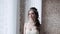 Brunette bride in fashion white wedding dress with makeup