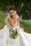 Brunette bride by the water