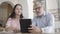 Brunette businesswoman listening bearded colleague