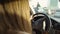 Brunette female standing in a traffic jam. Woman driving automobile. Transport