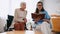 brunette geriatrician nurse reading book to