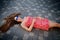 Brunette girl lying on the cobblestones in the central part of the old city in a sunny summer day