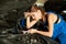 Brunette girl mechanics repairing or inspecting a car