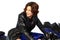 Brunette girl on motorcycle leather jacket