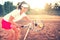 Brunette girl playing tennis with racket, balls and sports equipment. Close up portrait of beautiful woman on tennis cou