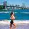 Brunette girl running in New York Brooklyn bridge