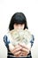 Brunette girl showing out of focus money in hands