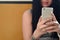 The brunette girl takes selfie on a modern touch smartphone