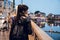 Brunette girl walking through the Naviglio Grande neighborhood in Milan, Italy