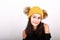 Brunette girl in in yellow cap with brown bobbles