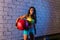Brunette gym girl holding weighted ball