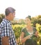 Brunette and handsome man talking in the vineyards