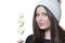 Brunette lady holding a candy skewer