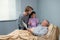 Brunette little girl with her dad visiting her grandfather at the hospital