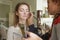 Brunette make up artist woman applying make up for a caucasian b