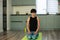 Brunette middle aged woman doing yoga meditation on exercise mat at home, mental health. Peaceful woman meditate, mental