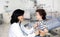 Brunette pediatrician at the hospital with a baby