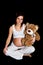 Brunette pregnant woman with teddy bear on black
