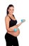 Brunette pregnant woman training with dumbbells