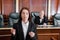 brunette prosecutor pointing with finger during