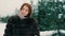 Brunette rich woman waist coat of brown fur on background of Christmas tree slow motion